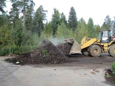 Mixing the heaps during Summer 2015 composting tests
